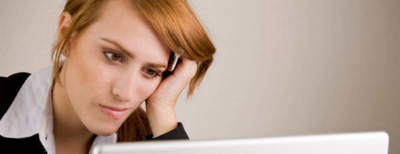 Frustrated woman on computer foter